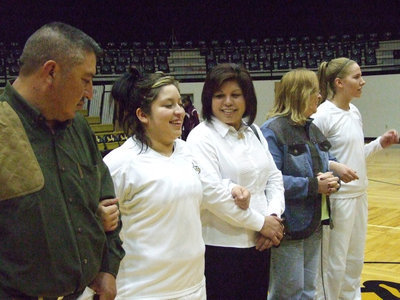 Image: Blanca and Becca — Blanca and Becca get escorted by their parents before their last home game. These two will be greatly missed.