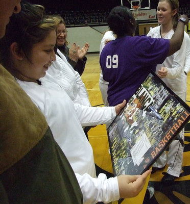 Image: Blanca in collage — For Senior Night, Blanca Figueroa receives a framed keepsake that will always remind her of the glory days.