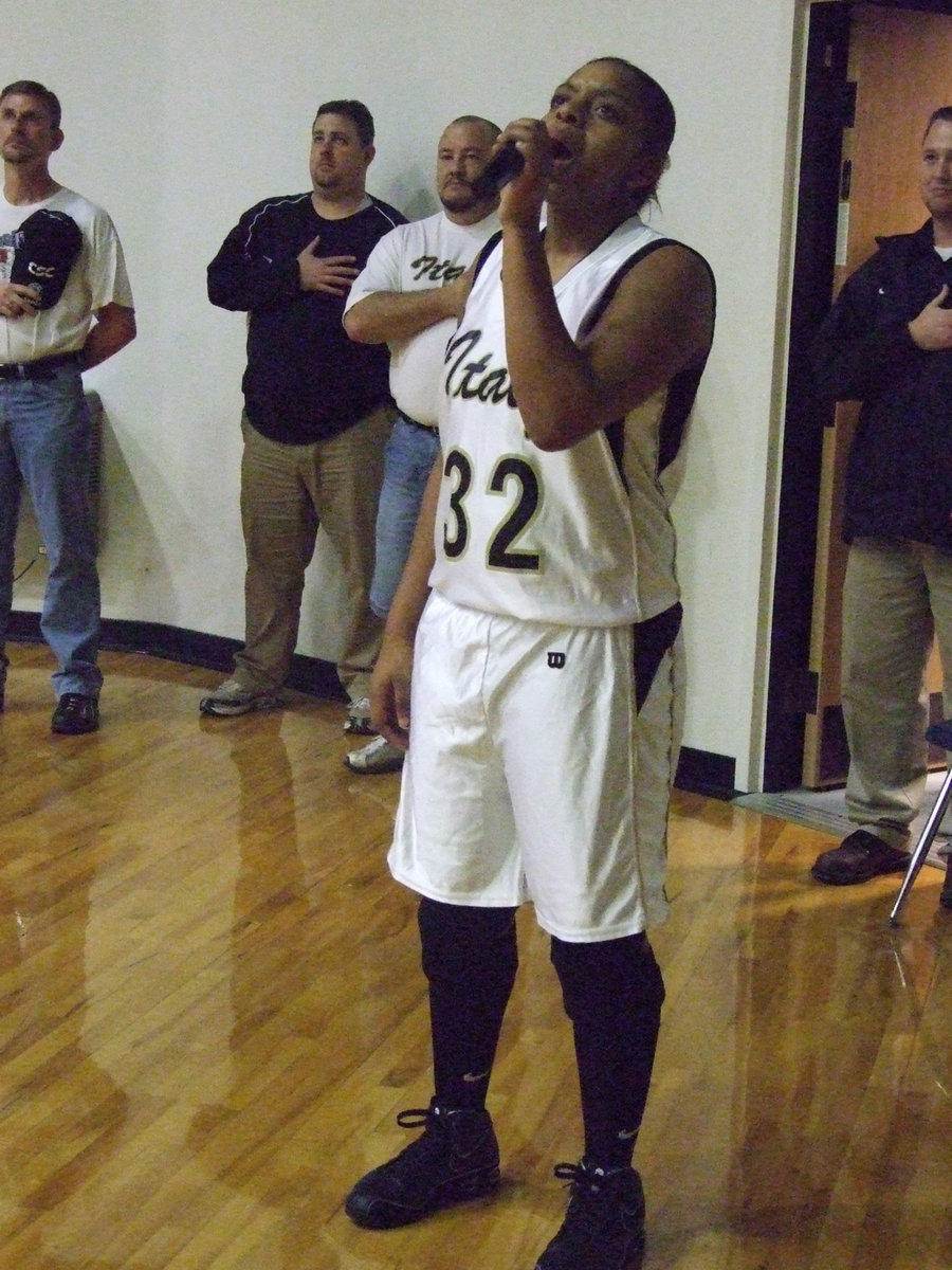 Image: Shay sings — Shay Fleming and her backup dancers, The Staffsations, perform the National Anthem on Senior Night.