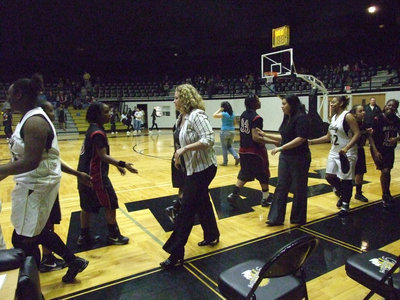Image: Coaches and players — Head Coach Stacy McDonald and Assistant Coach Tina Richards shake hands with the opposing team…while barely being able to contain their excitement. Coach McDonald’s “Girls” played great gaining momentum for their playoff game Tuesday at 7:30 in West, Texas at the high school.