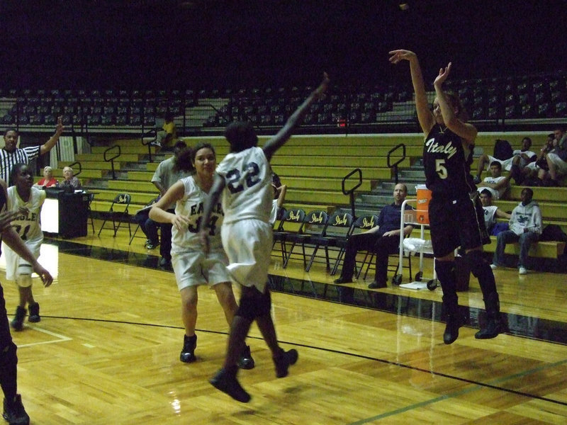 Image: DeMoss delivers — DeMoss releases a 3-pointer against the Lady Eagles.