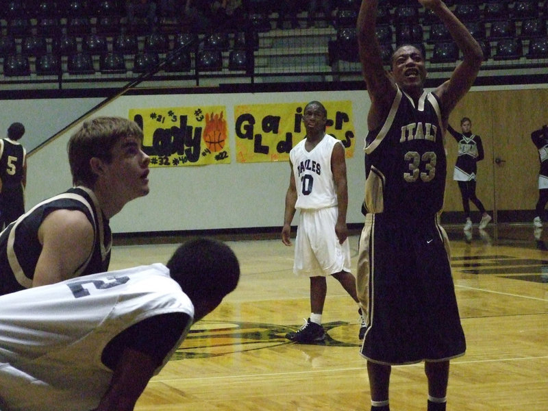 Image: Mr. Dramatic — Italy’s #33 Darrin Moore shoots this free throw as if a trip to the playoffs depended on it.