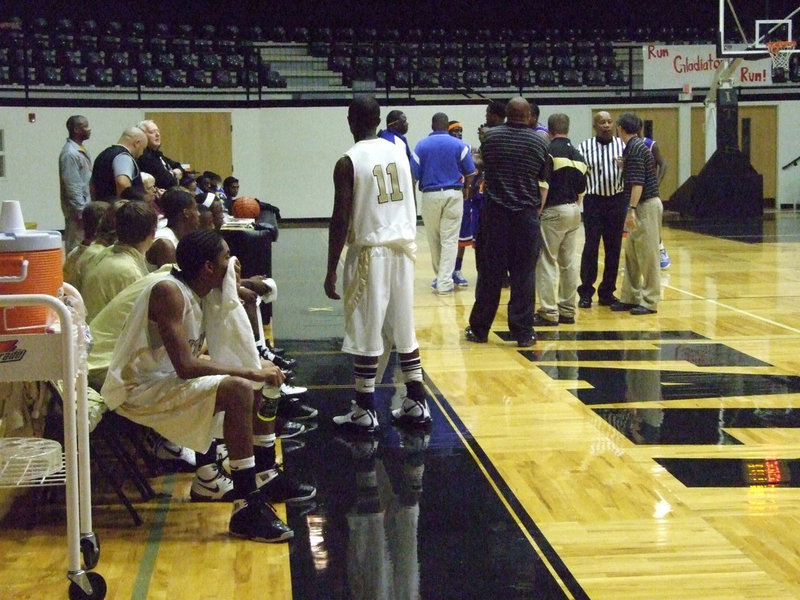 Image: Ejections — Referees try to get a handle on the choas during the game. Two Italy players were ejected, one Gateway player and one Gator fan were ejected.