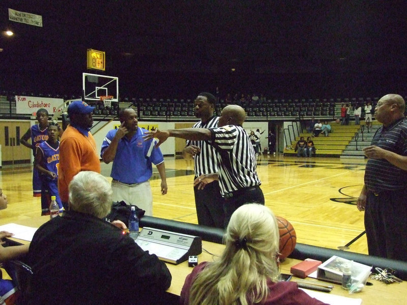 Image: Referees sort it out — The referees had a mess to clean up by the end of the 2nd period between Italy and Dallas Gateway after the game became a bout.