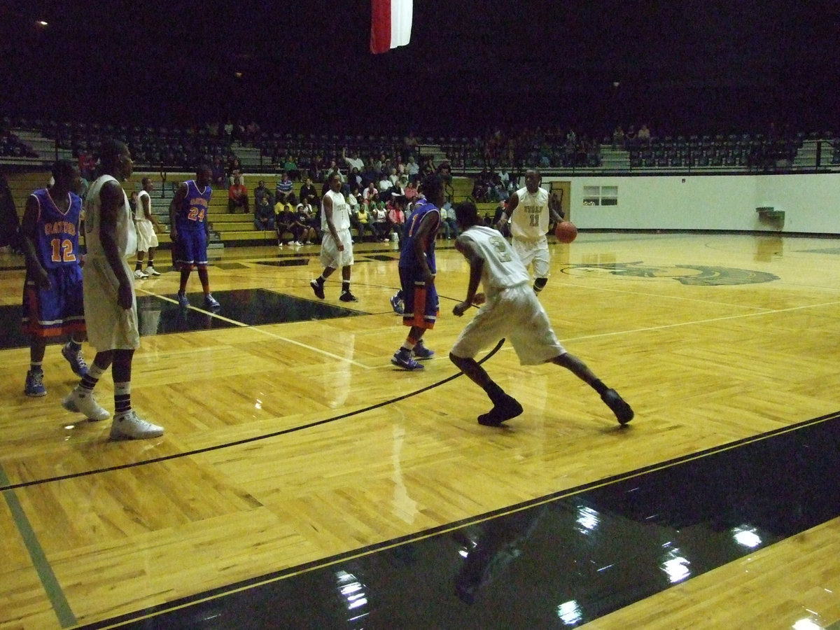 Image: Jasenio throws a left — Jasenio Anderson #11 throws his left jab.  Heath Clemons #2 trying to soften up the Gator defense.