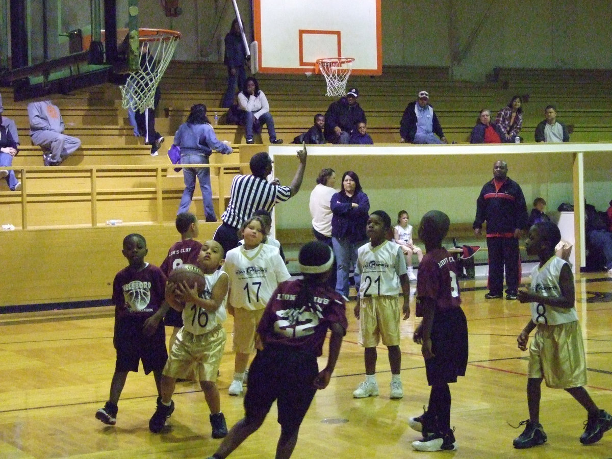 Image: Cornelius Jones — Italy 9’s #16 rebounds the basketball against Hillsboro Maroon in the coed 1st and 2nd grade division. Italy won the close matchup 30-24.