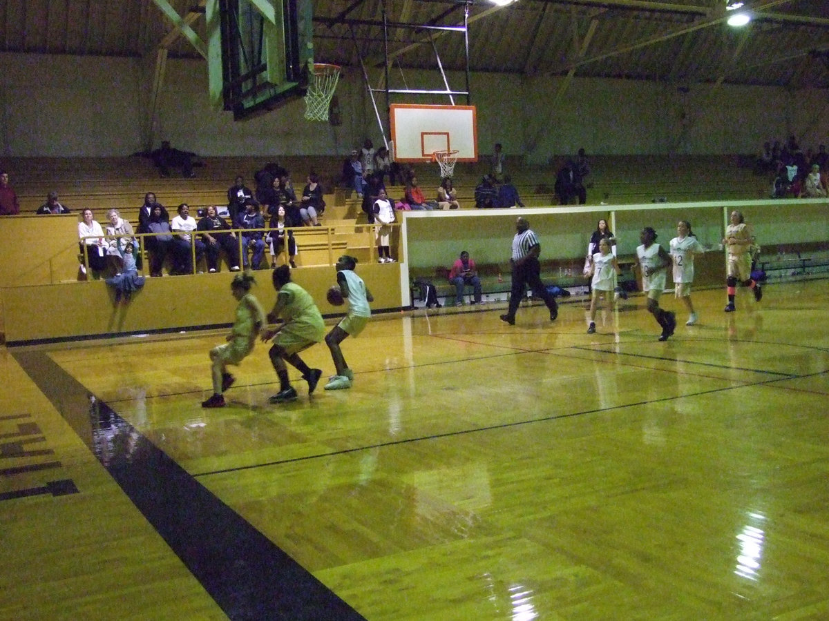 Image: Robertson Pumps — Italy 24’s Janae Robertson pump fakes against members of Italy 24 before she rises for a score.