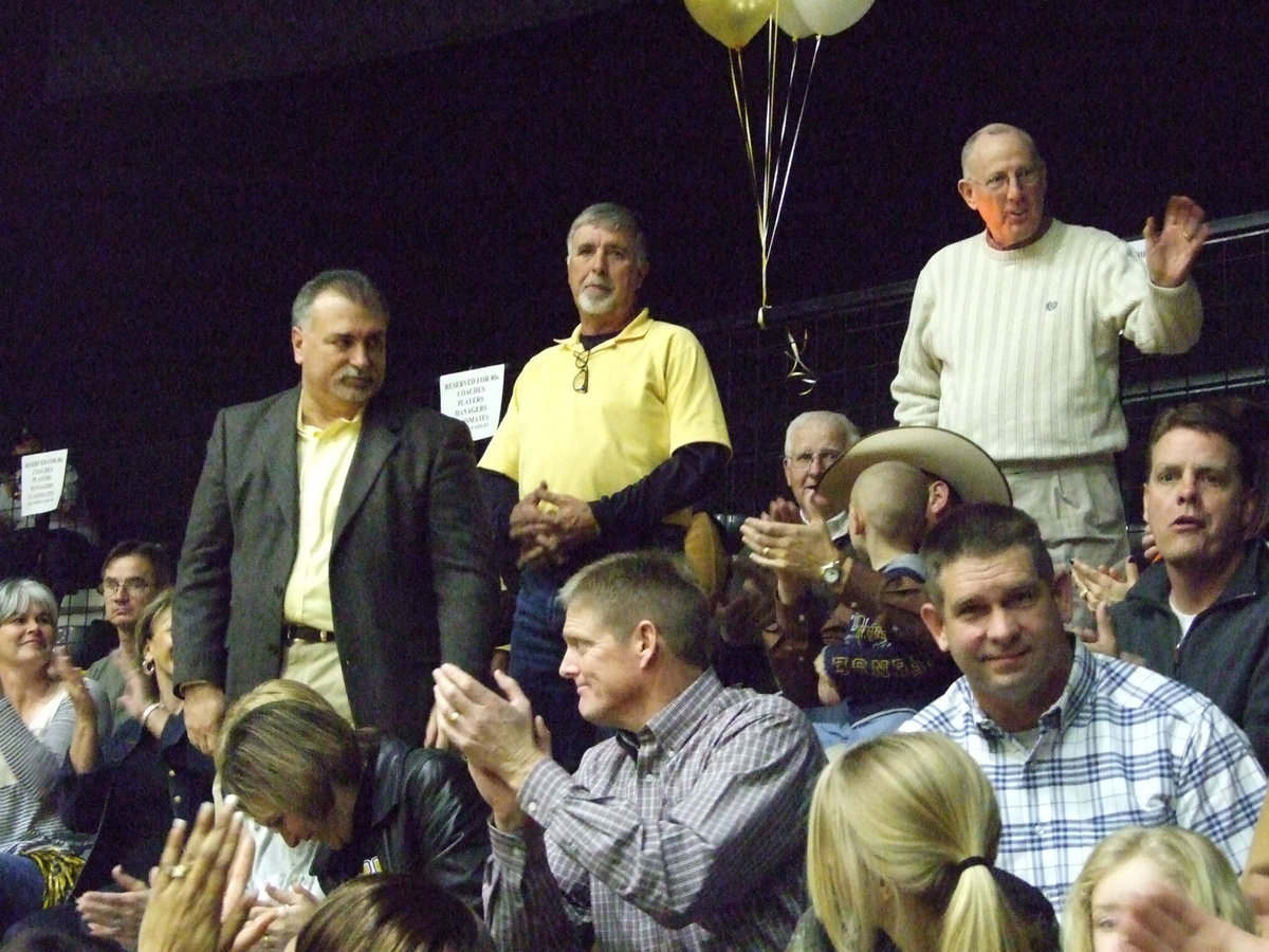 Image: The Big Three — Standing during their introductions are former Italy educators and coaches (left to right) Gene Burton, Chris Storer and Willie Roten. These three men are credited with establishing a winning tradition in Italy that has carried over still today.