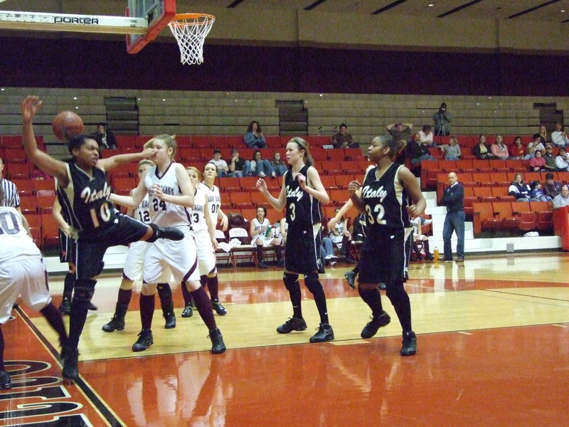 Image: Birdsong Attacks — Italy’s #10 Kyonne Birdsong is fouled driving to the hoop.