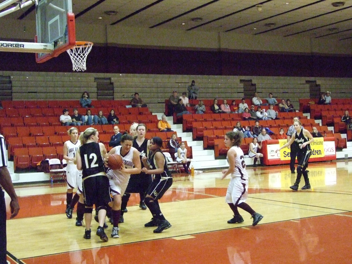 Image: Breaking Out — A Mildred Lady Eagle comes out with a rebound against the Lady Gladiators.