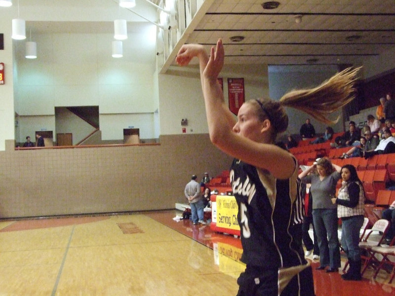 Image: Superstar — Is it a bird? Is It a plane? It’s Superstar Becca DeMoss shooting practice shots during halftime. DeMoss would prove to be the hero in this one by making 2 winning free throws at the end of regulation.