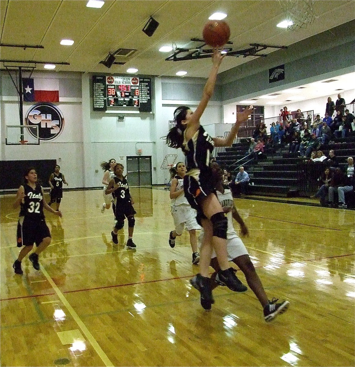 Image: Mata has skills — Italy JV Lady Gladiator Paola Mata(12) finishes a fast break opportunity against Grandview.