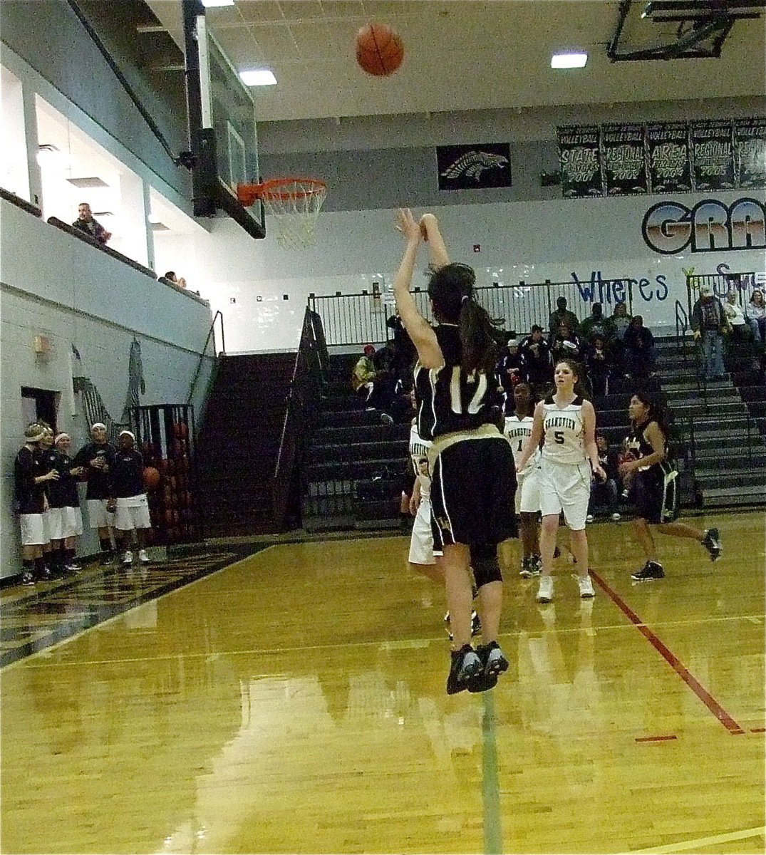 Image: Still shooting — Paola Mata(12) and her JV Lady Gladiators teammates played hard from tip-off to final buzzer despite trailing the Zebras early.