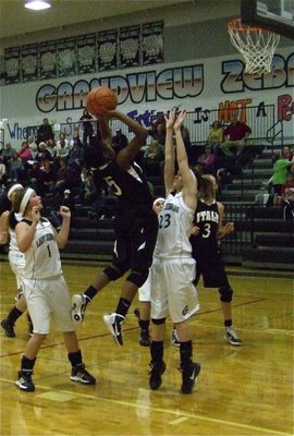 Image: High five — Lady Gladiator point guard Jameka Copeland(5) goes up strong against Grandview’s center.
