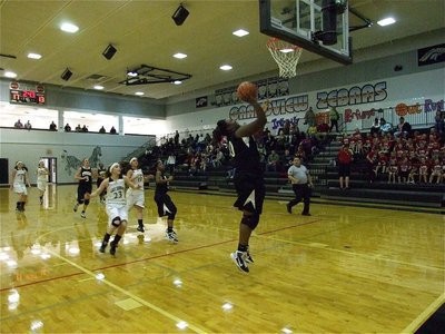 Image: Reed scores again — Lady Gladiator Jimesha “Mesh” Reed(40) takes advantage of a wide-open look at the basket.