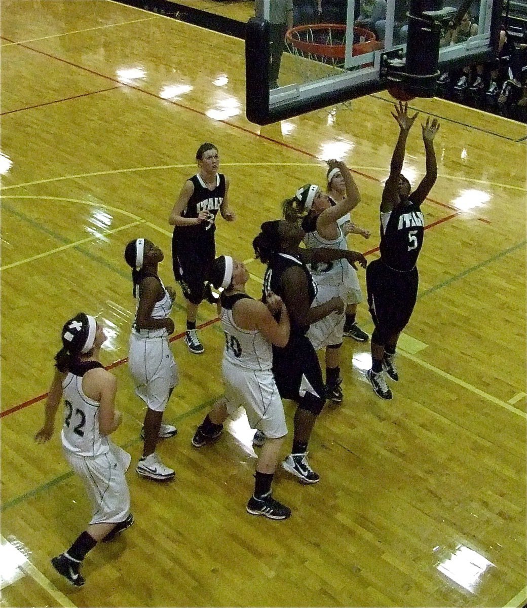 Image: Copeland scores — Jameka Copeland(5) scores underneath with teammates Kaitlyn Rossa(3) and Jimesha Reed(40) near by.