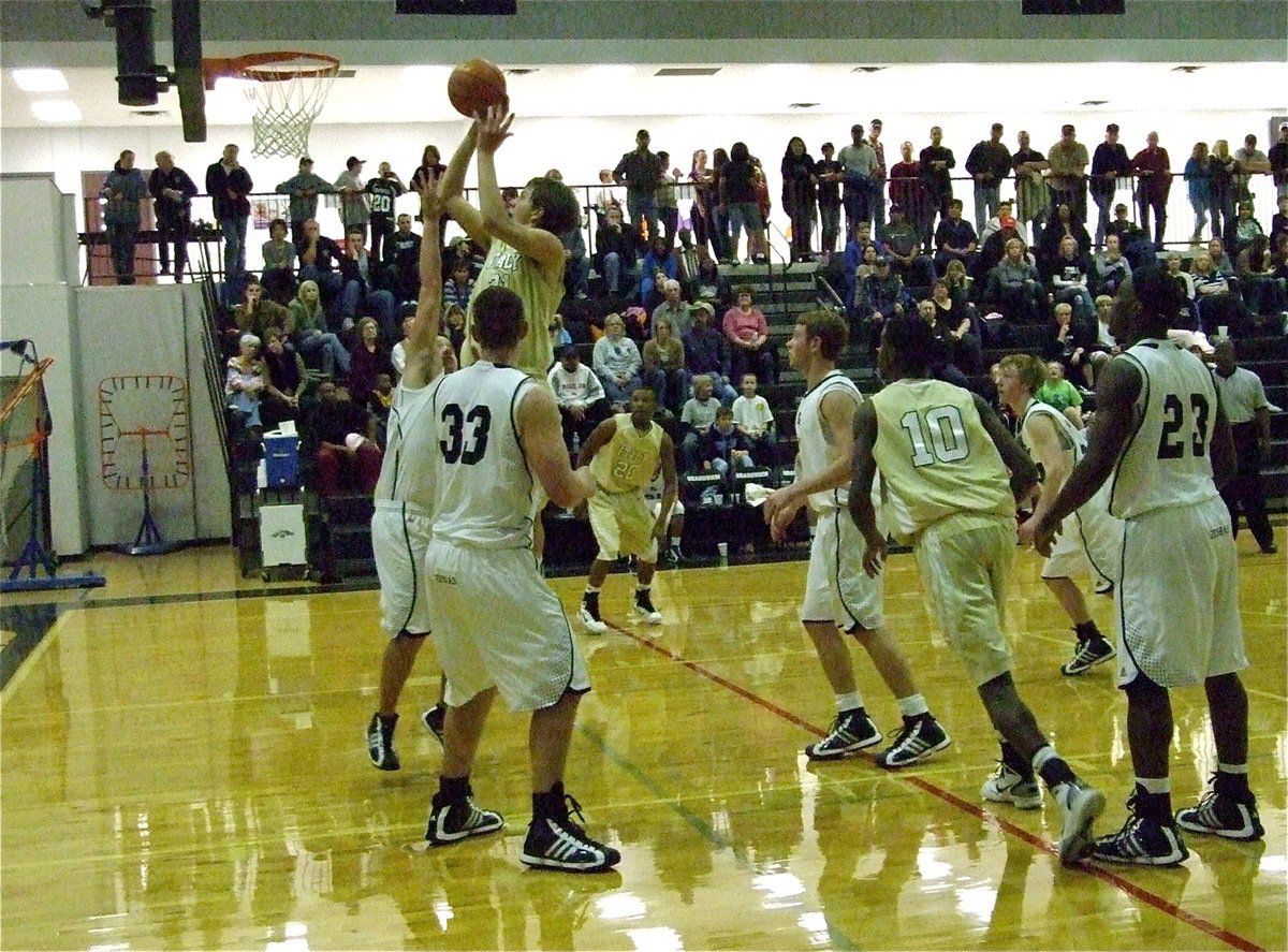 Image: Cole earns stripes — An attacking Cole Hopkins(21) devours the Zebras inside the paint.