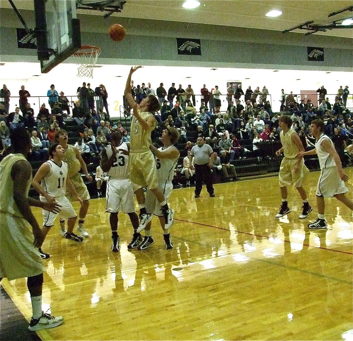 Image: Holden hoops — Gladiator Jase Holden(3) gets up a shot despite being surrounded by Zebra defenders.