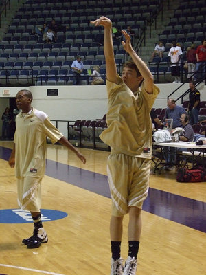 Image: Heath and Dan — Italy’s Heath Clemons and Dan Crownover warm up before taking on Lindsay. These two young men do whatever it takes to help their team win.