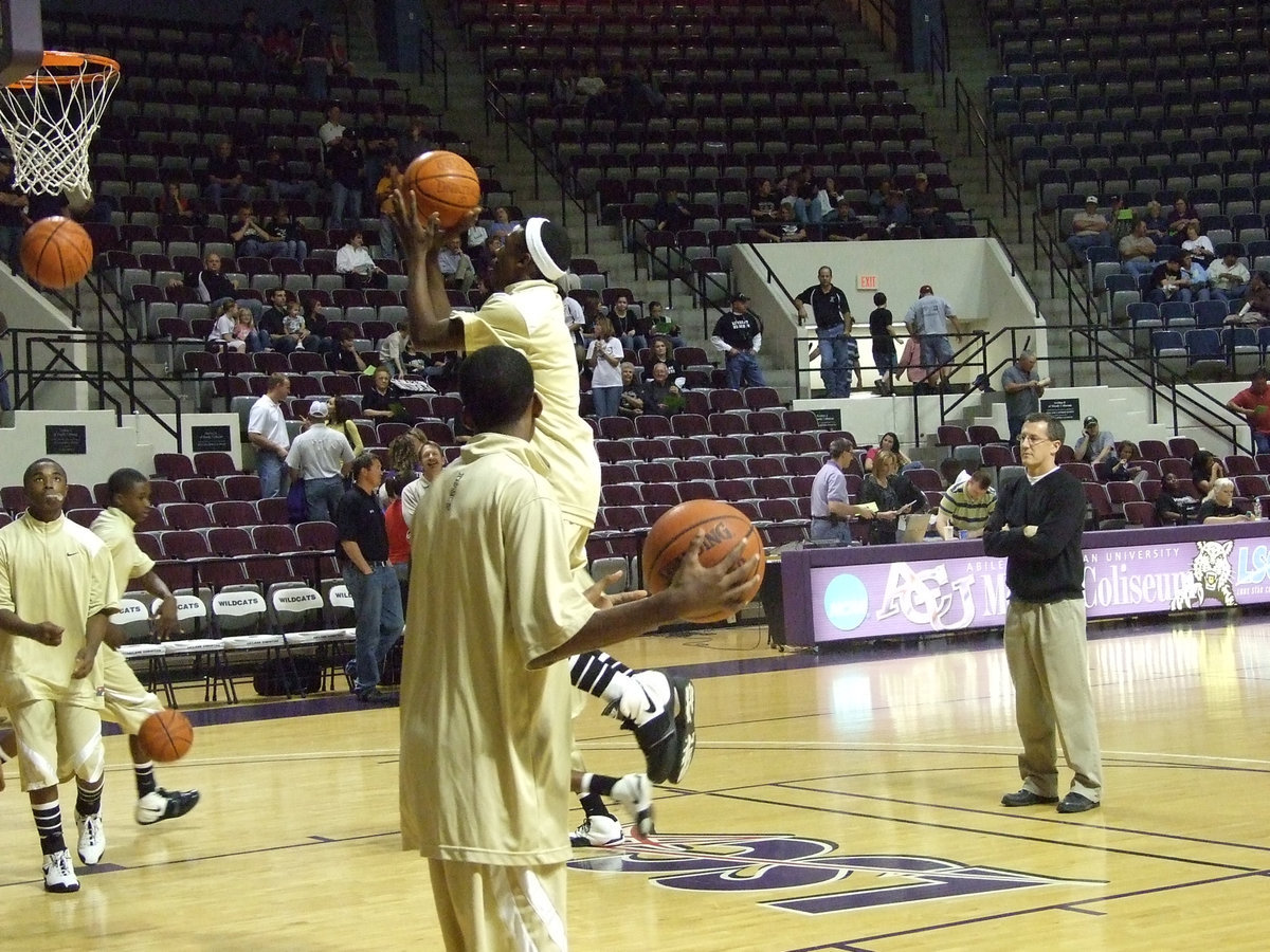 Image: Coach Holley studies — Italy Head Coach Kyle Holley isn’t concerned with the Lindsay players warming up behind him…he’s only concerned with his guys.