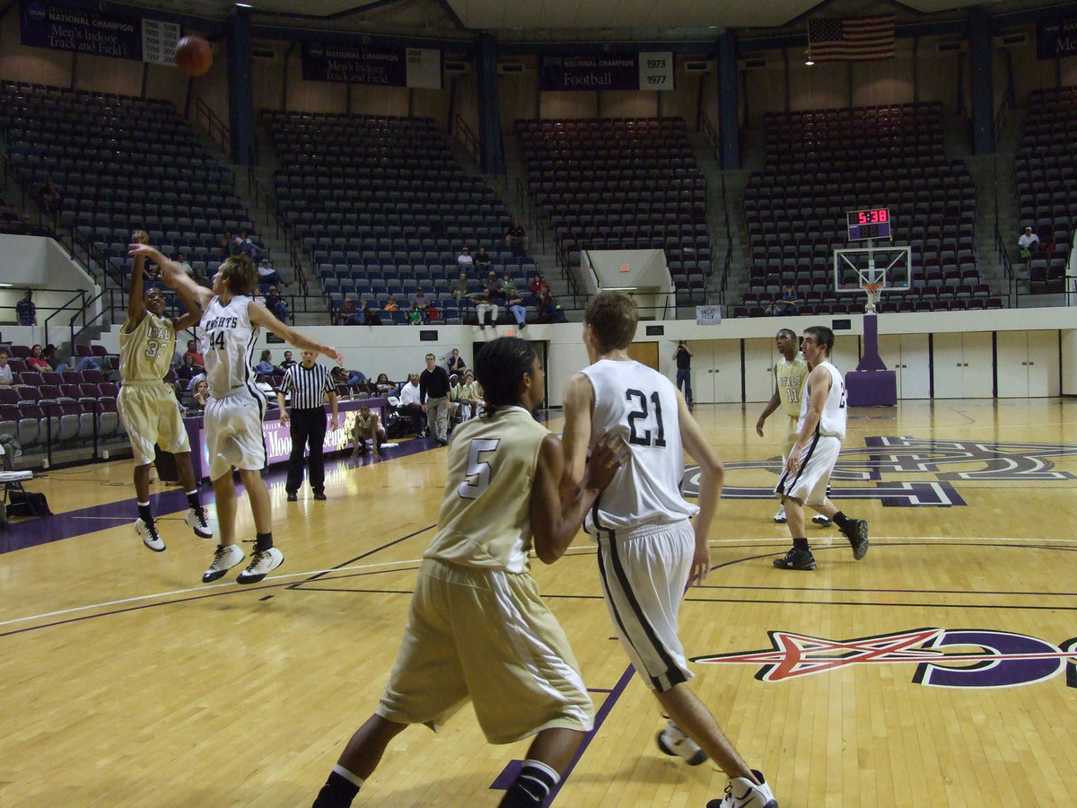 Image: Moore good news — Darrin “Butter” Moore found his range Friday night nailing two 3-pointers.