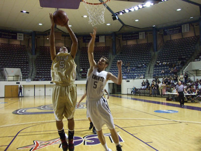 Image: Clemons goes up — Dontavius Clemons #5 rises for two of his 7-points against Lindsay.