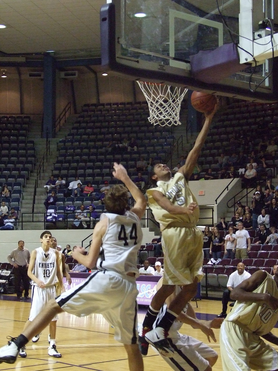 Image: And-1 — Senior Dontavius Clemons #5 scores and hits the and-1 to make 3-points the old fashion way.