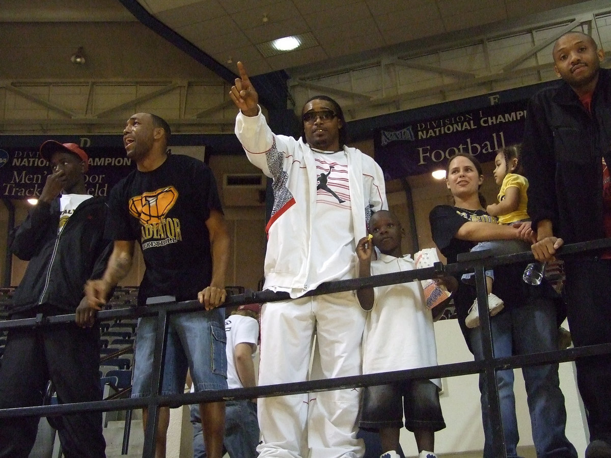 Image: The NFL’s Keith Davis — NFL stand out Keith Davis, who was member of Italy’s 1997 State Championship team, leans over the railing to lend his support and let the Lindsay Knight fans know who is #1. The Gladiators stole the night and won the Regional Semifinal Championship 74-64.