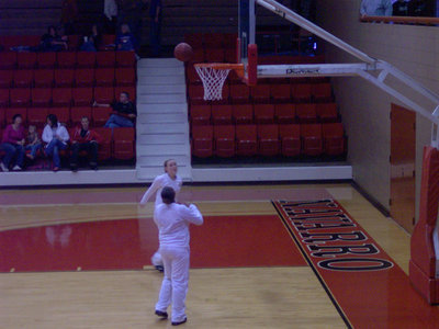 Image: Warming Up — The Lady Gladiators get warmed up before their 1st round contest against the Wortham Lady Bulldogs.