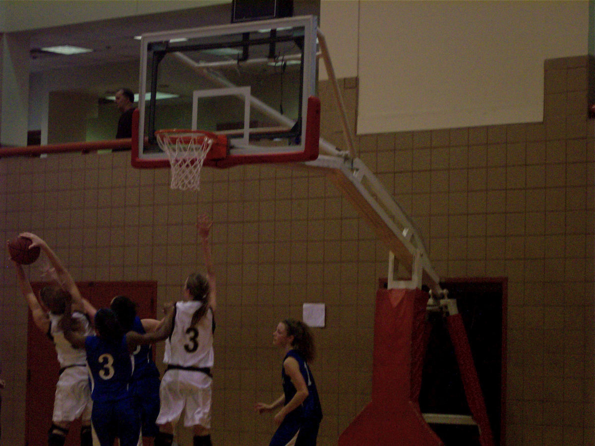 Image: Big Board — Italy’s #5 Becca DeMoss wrestles down a rebound against Wortham.