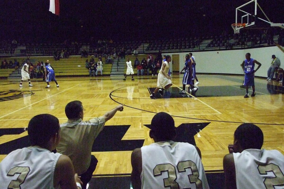 Image: Coach Holley Leads His Troops — Italy Head Coach Kyle Holley leads his troops against the Milford Bulldogs Tuesday night at the Italy Coliseum. Italy captured the win in this neighborly rivalry 63-53.