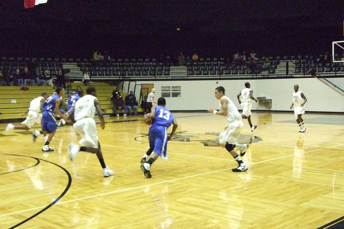 Image: Fullcourt Defense — Milford’s #13 weaves his way through the Gladiator defense in the 1st half.