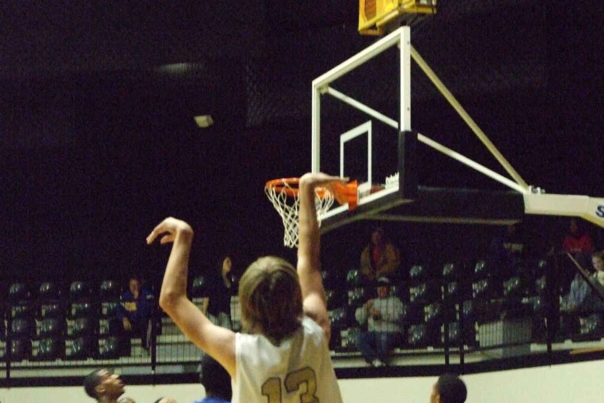 Image: Sharp Shooter — Colton Campbell #13 releases a shot over the Bulldog defense.