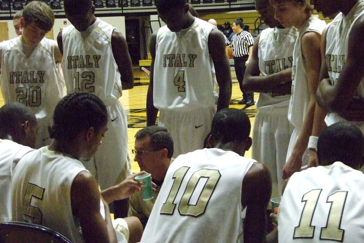 Image: Coach Holley Strategizes — Although the Gladiators trailed for most of the game, Coach Holley kept his players relaxed and confident they could come back and win.