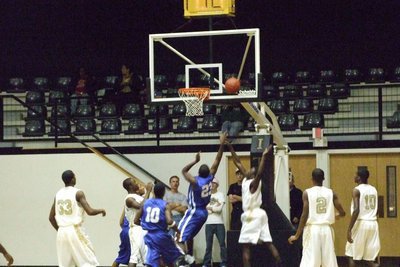 Image: Milford Scores Inside — Milford’s #23 scores and draws a shooting foul against the Gladiator defense.