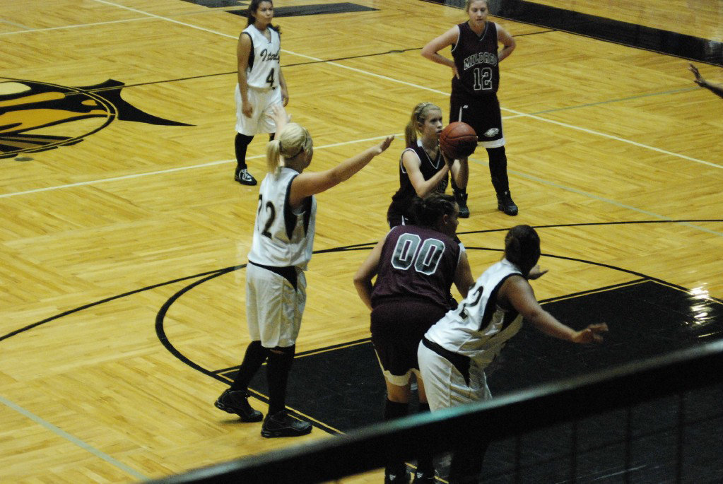 Image: Rebound — Italy’s #4 Marisela Perez, #22 Megan Richards and #32 Shay Fleming prepare to rebound a Mildred free throw. Rebound they did as Italy came from behind after a sluggish start to beat the Lady Eagles 35-31.