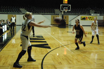 Image: Megan Richards Passes — Italy’s #22 Megan Richards zips a pass into the flank of the Mildred zone defense. Mildred won the battles but lost the war as the Lady Gladiators ambushed the Lady Eagles inside the dome.