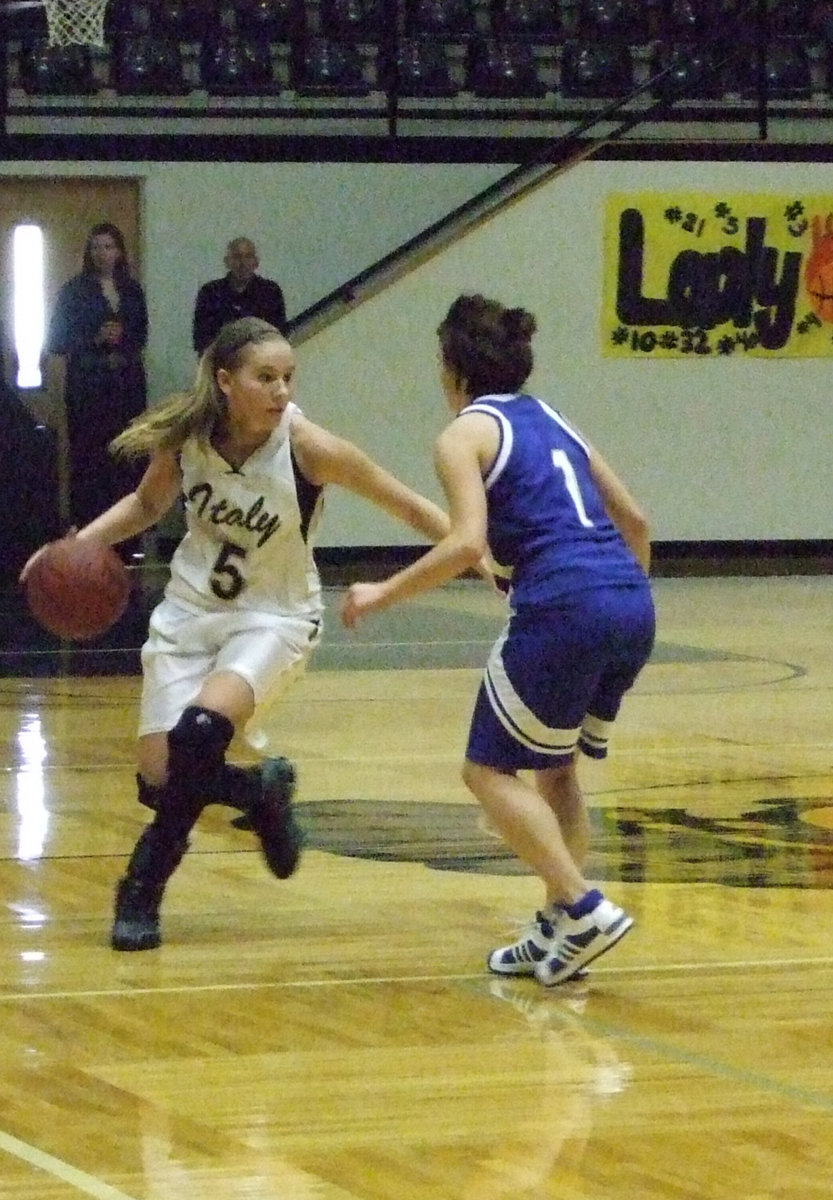 Image: DeMoss Dribbles — Senior Captain #5 Becca DeMoss pushes the ball up the court and into the second round after the Lady Gladiators passed Venus with a 43-37 win. DeMoss scored 25-points in tournament opener.