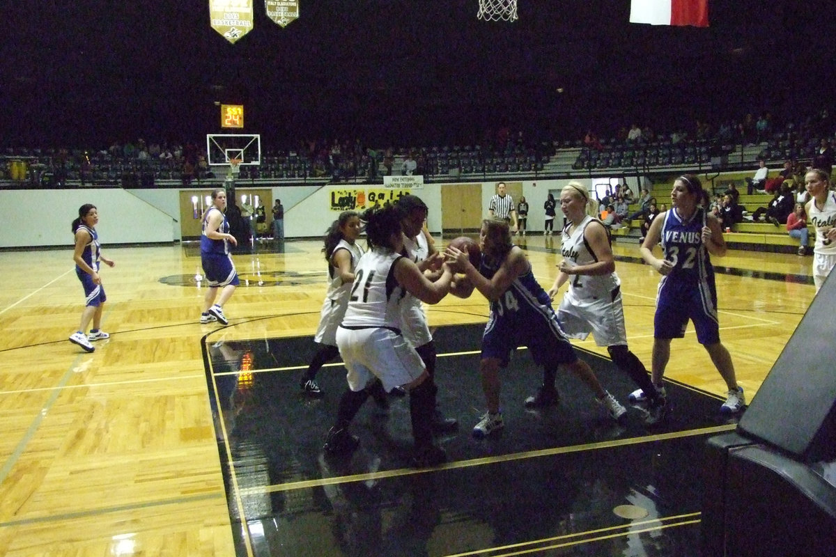 Image: Dog Fight — The Lady Gladiators scrapped and clawed their way back into the game eventually out lasting the Lady Bulldogs for a 1st round victory.