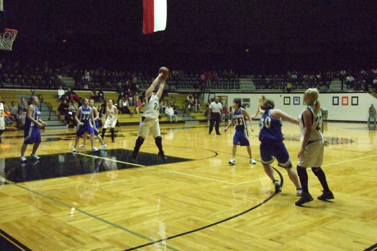 Image: Senior Blanca Figueroa — Senior #21 Blanca Figueroa stretches out to grab the pass from teammate #22 Megan Richards.