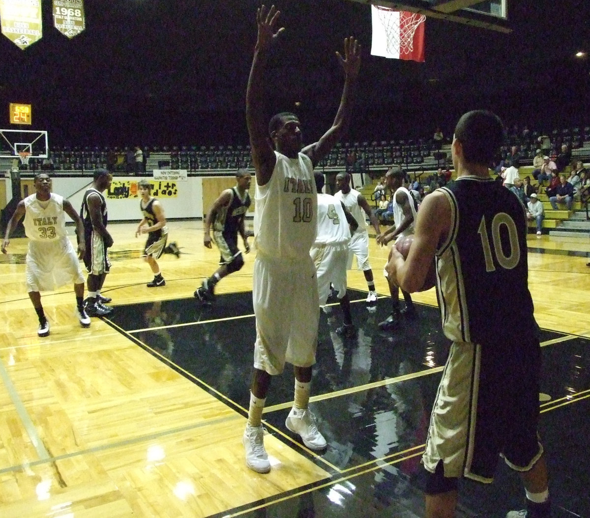 Image: John Isaac — Isaac tries to block entrance to the ball.