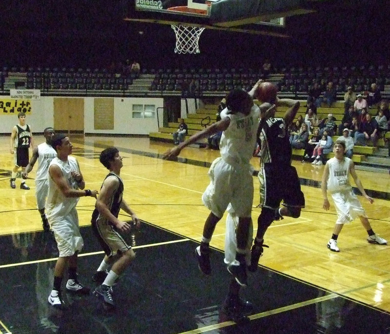 Image: Donatvius Clemons — Clemons was up in the air to block the Jacket score.