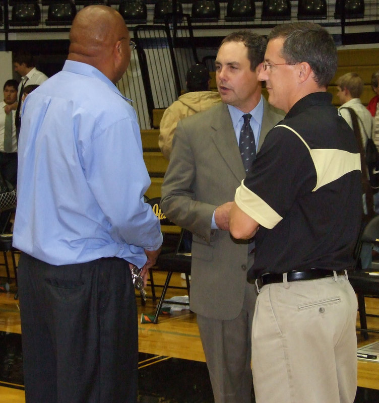 Image: Italy Welcomes Meridian — Coaches Larry Mayberry and Kyle Holley welcome Head Coach Rich Powers to the Gladiator Coliseum.