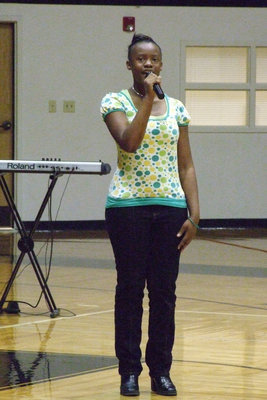 Image: Brianna Sings — Brianna Burkhalter sang “Star Spangled Banner” during the assembly