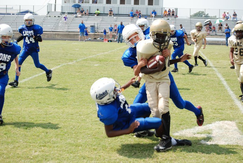 Image: Bringing down the runner — Blooming Grove defense stopped Italy at every turn.