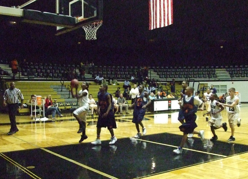 Image: Robertson scores a layup — #3 Tray Robertson cashes a bank shot in for 2-points.