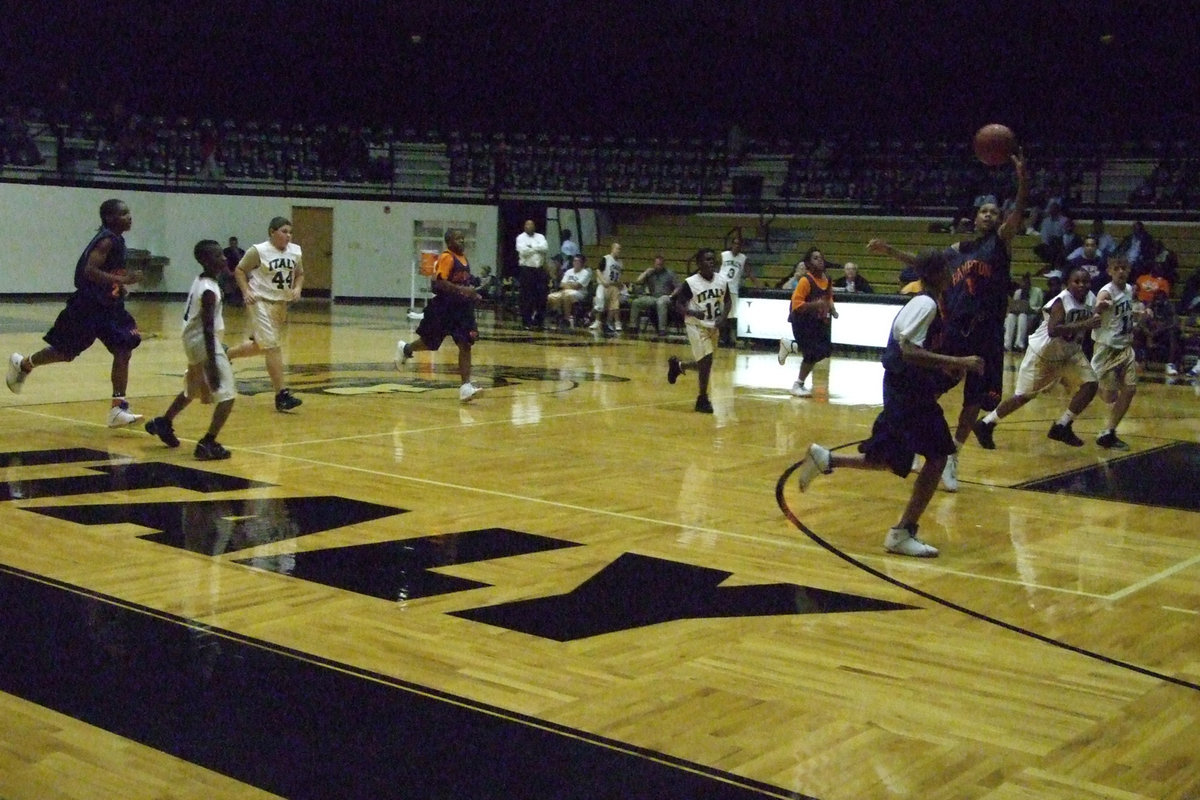 Image: Hampton Fast Breaks — Hampton’s fast break was almost unstoppable as #23 Blakely passes ahead to #15 Jefferson.