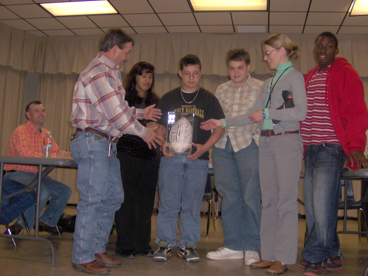 Image: Prized Possession — The CBI class donated a Dallas Cowboy autographed football to the school district.