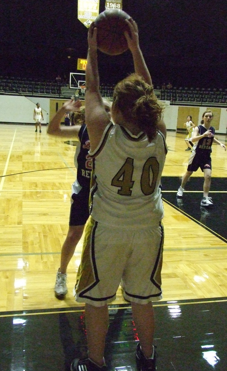 Image: Throw It In! — Katie Byers waits for the right moment to put the ball into play.