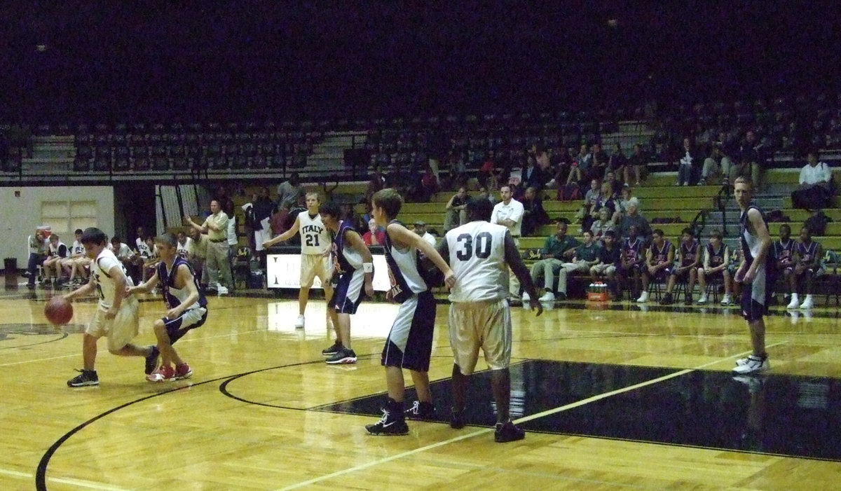 Image: Reed Jacinto — Jacinto dribbles around a Red Oak defender.